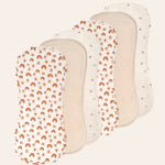 Six muslin baby bibs with different patterns on a white background