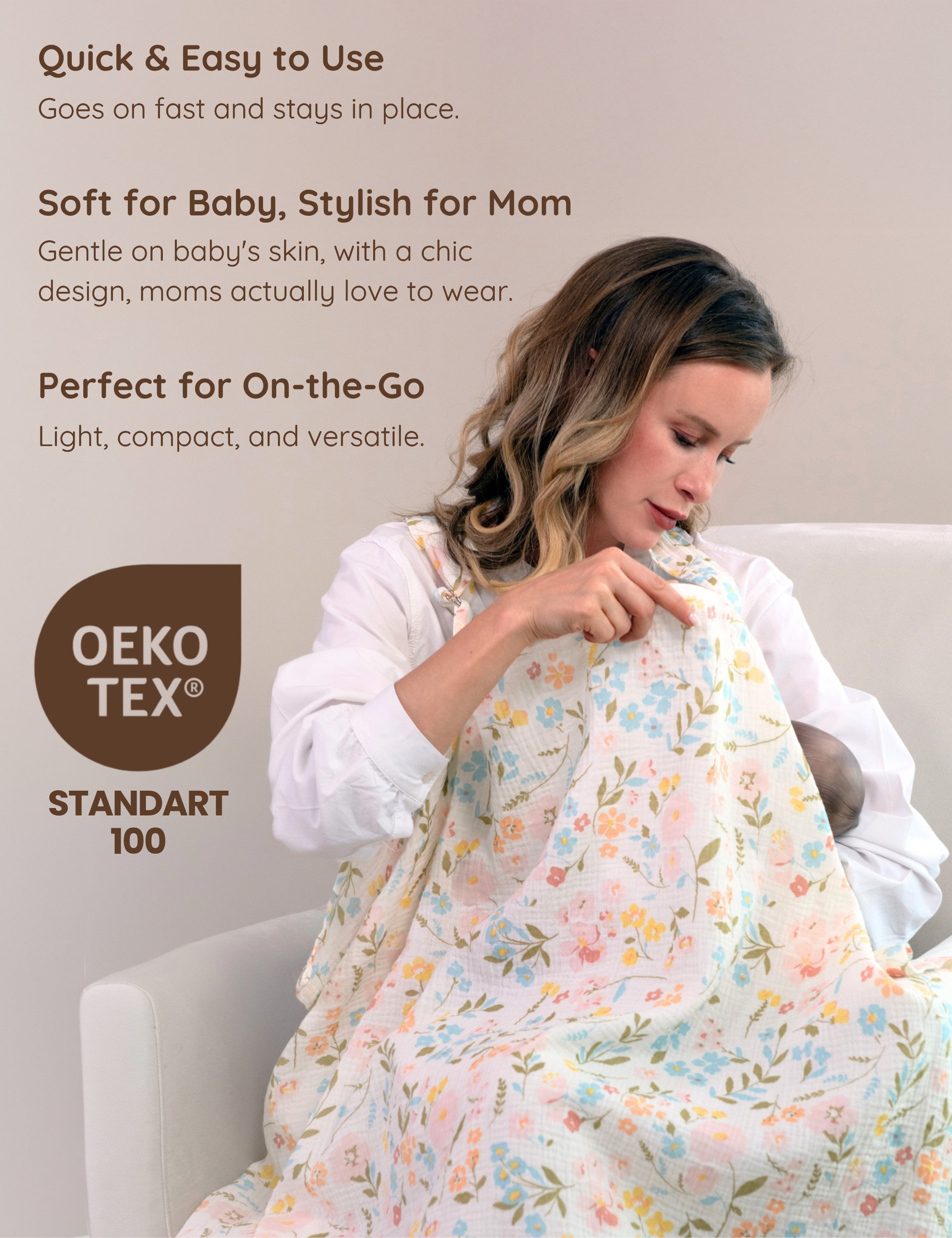 Mother breastfeeding her baby with a floral patterned muslin nursing cover.