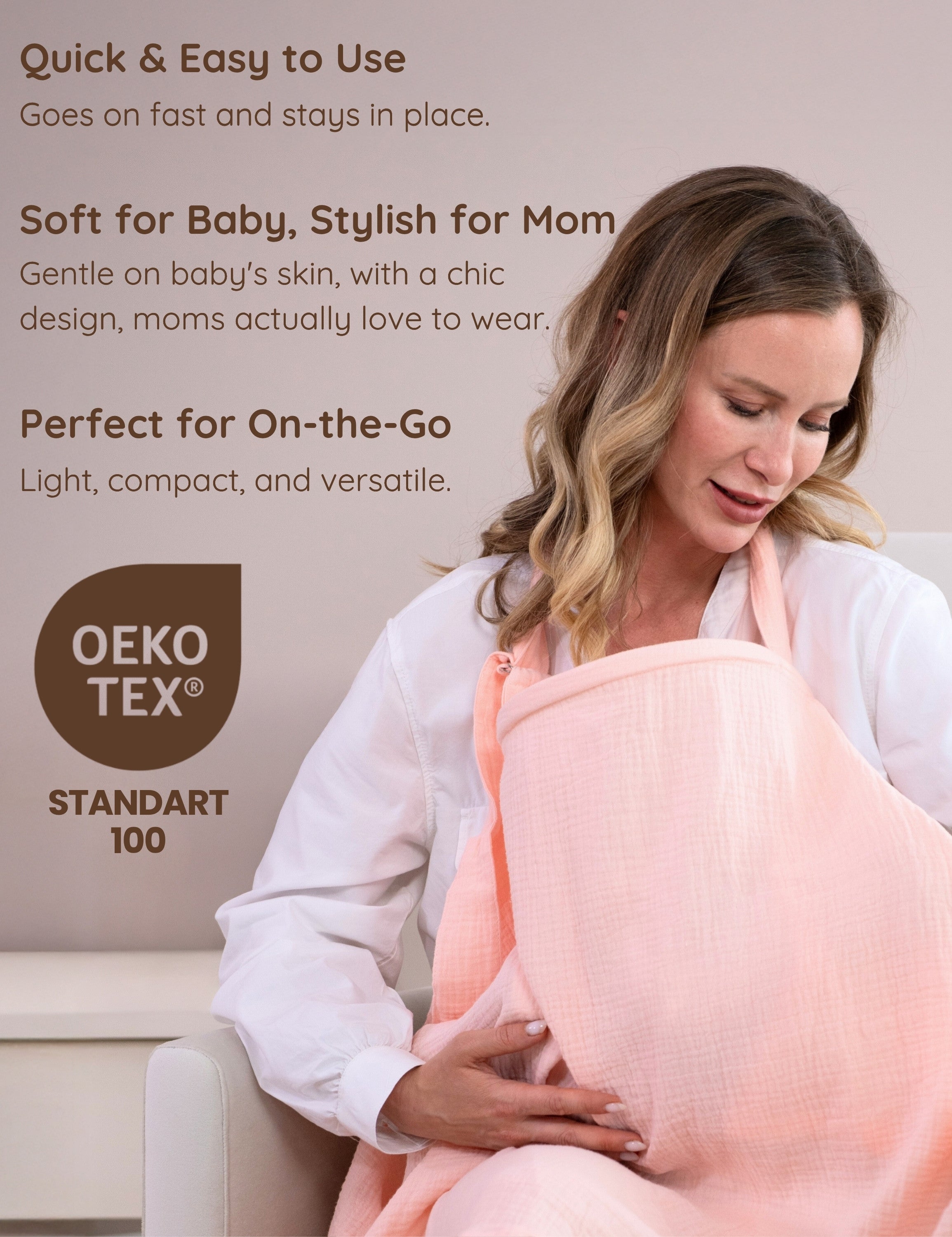 Mother breastfeeding her baby with a pink muslin nursing cover.