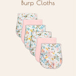 Set of six ultra-soft muslin burp cloths with floral patterns and solid pink colored patterns displayed together