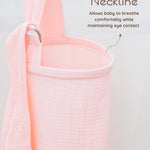 Solid pink muslin nursing cover with text explaining the boned neckline design on a light gray background