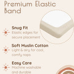 Solid beige muslin bassinet sheets with premium elastic band features on a beige background