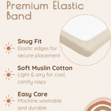 Solid beige muslin bassinet sheets with premium elastic band features on a beige background