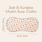 Rainbow patterned muslin burp cloth with measurements on a light background