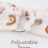 Rainbow patterned beige adjustable strap of a muslin nursing cover