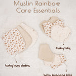 Baby care products including baby burp cloths, bibs and bandana bibs on a light background.